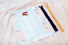 sewing supplies laid out on top of a sheet of paper with measurements for each piece