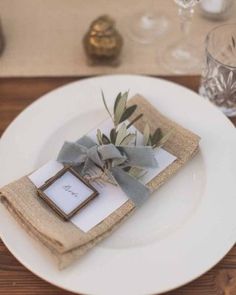 a place setting with napkins and silverware