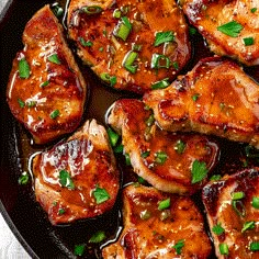 chicken with sauce and green onions in a skillet