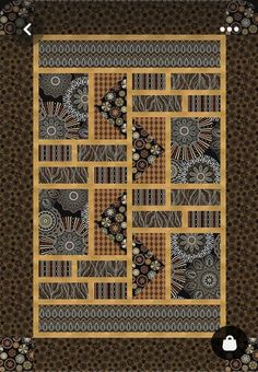 a yellow and black quilt with an intricate design on the front, along with several different patterns