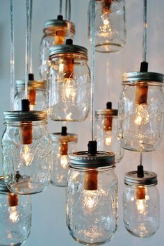 mason jar chandelier with lights hanging from the ceiling