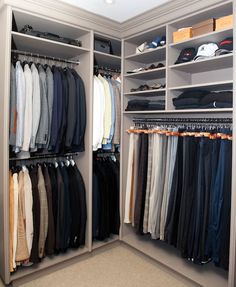 the closet is full of men's shirts and pants