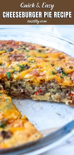 a cheeseburger pie is cut into slices on a plate with the rest of the pie in the background