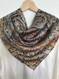 "Elegant, versatile multi color artistic print natural mulberry silk large square scarf with size of 110 cm x 110 cm / 43 in x 43 in. Quality silk fabric and fine print, hand rolled edges, smooth and lustrous silk charmeuse, shines subtly, breathable and skin-friendly feels very soft and comfortable to wear. Can style in many ways: wear the scarf as a large neck scarf, as an evening shawl and cover up, as a large hair scarf, as a head scarf, ...or style it any way you want with your own sense of creativity! Suitable for all seasons and is a wonderful gift idea for special occasions. Care Instructions: Pure silk is a type of organic and natural fabric, please avoid washing. Dry clean recommended. Stored in a cool, dry, and dark place.  Iron reverse side on silk setting acceptable.  Please f Luxury Zari Work Silk Scarf, Luxury Traditional Katan Silk Scarf, Bohemian Paisley Print Patterned Silk Scarf, Bohemian Paisley Print Silk Scarf, Multicolor Silk Scarf With Paisley Print, Elegant Patterned Silk Shawl Scarf, Elegant Patterned Silk Shawl, Elegant Patterned Silk Scarf With Paisley Print, Bohemian Silk Square Scarf