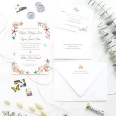 the wedding stationery is laid out and ready to be put into their guests'envelopes