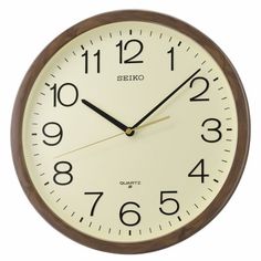 a wall clock with numbers on the front and back of it's face is shown