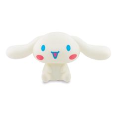 a white toy with blue eyes and ears