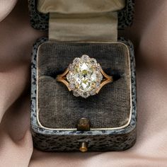 an antique diamond ring in a velvet box