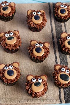 some cupcakes are decorated with brown icing