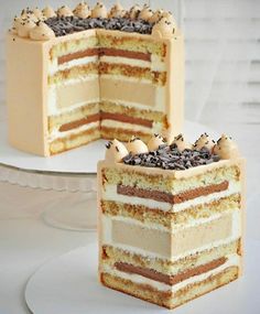 two pieces of cake sitting on top of a white plate with one slice cut out