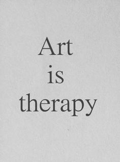 the words art is therapy written in black ink