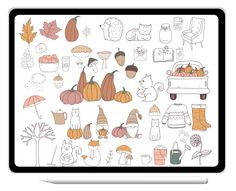 an open laptop computer sitting on top of a white table covered in doodles and pumpkins