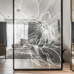 an artistic glass screen in the middle of a room