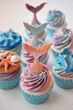 cupcakes decorated with sea creatures and seashells