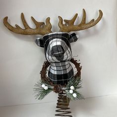 a deer head with antlers on top of it