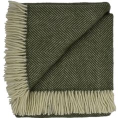 a green and white blanket with fringes on it's edges, folded in two rows