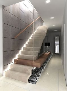 a modern staircase with stone steps leading up to the second floor