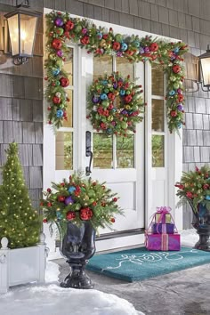 christmas decorations on the front door of a house