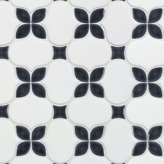 a black and white tile pattern with circles in the shape of an abstract flower design