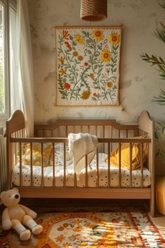 a baby crib with a teddy bear in the corner