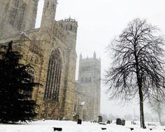 an old church in winter with snow on the ground