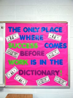 a pink bulletin board with money on it