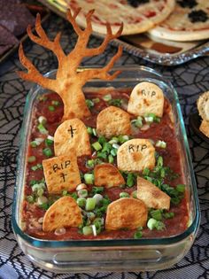 a glass dish filled with food on top of a table