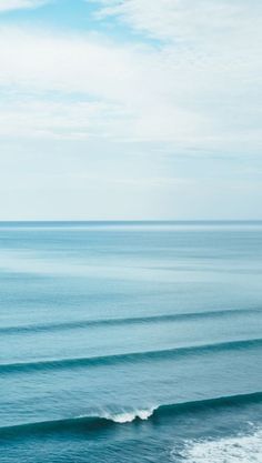 two surfers are riding the waves in the ocean