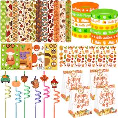 the contents of a happy fall themed birthday party including candy, decorations and stickers