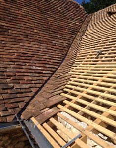 the roof is being constructed with wood planks