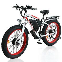 an electric bike with red rims on the front and rear tires, is shown