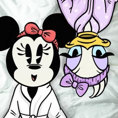 an image of mickey and minnie mouse cartoon characters on white sheet with polka dot background