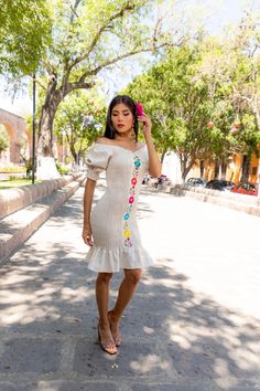 This Beautiful Dress boasts a Traditional Mexican floral design combined with a modern style dress. The embroidered elastic bodice combined with the off the shoulder sleeves makes it fun and flirty. It's made out of fine Mexican cotton and has an elastic bodice for an adjustable fit. This dress is handmade and embroidered by Mexican Artisans in Guanajuato, Mexico. Summer Embroidered Dress With Straight Neckline, One-shoulder Embroidered Fitted Dress, Fitted Embroidered Mini Dress For Summer, Fitted Embroidered Dress For Summer, Off-shoulder Embroidered Spring Dress, Floral Embroidered Off-shoulder Dress, Spring Embroidered Dress With Straight Neckline, Summer Off-shoulder Dress With Floral Embroidery, Summer Floral Embroidered Off-shoulder Dress