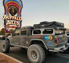 a jeep parked in front of the buffalo bill's sign