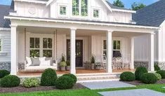 a white house with lots of windows and porches