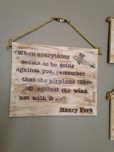 two wooden signs hanging on the wall next to each other with words written below them