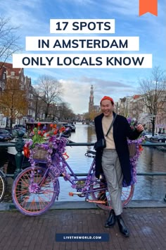 a man standing next to a purple bike with flowers on it and the words 17 spots in amsterdam only locals know