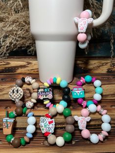 a coffee cup and some beads on a table