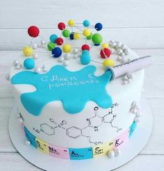 a birthday cake decorated with the chemical symbol and name on it's frosting