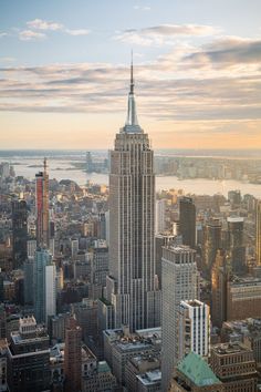 an aerial view of the empire building in new york city, ny at sunset or dawn