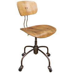 an old fashioned wooden office chair with wheels