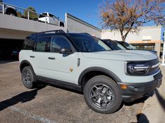 a white suv parked in a parking lot