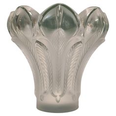 a glass vase is shown on a white background