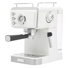 an espresso machine sitting on top of a white counter next to a black handle