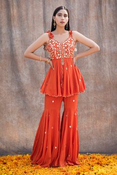 Sharara Tops Designs, Pattu Sharara Designs, Sharara Peplum Top, Orange Wedding Outfit, Traditional Peplum Sharara For Designer Wear, Festive Bollywood Peplum Sharara, Peplum Sharara For Wedding And Diwali, Elegant Festive Peplum Sharara, Diwali Embellished Peplum Sharara