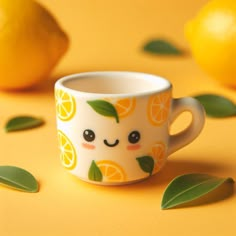 a cup that has some oranges on it