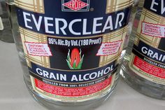 two bottles of everclear are sitting on the counter top next to each other