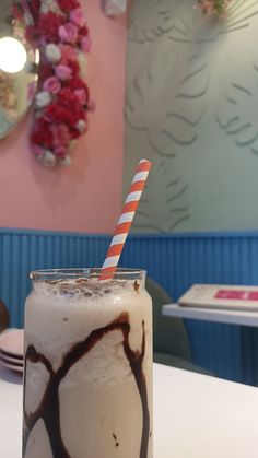 there is a drink with ice cream and chocolate on it