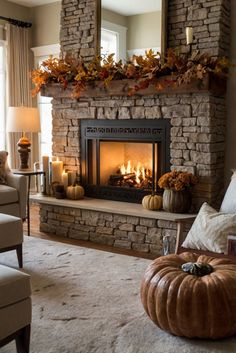 a living room filled with furniture and a fire place in front of a mirror on the wall