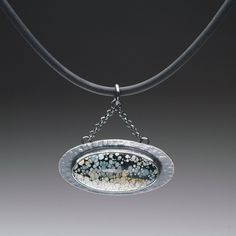 This unique pendant is made from a Polychrome White River Turquoise cabochon from China.  It is bezel set in an oxidized, textured decorative setting, with a horizontal orientation.  It comes with an adjustable black rubber necklace measuring 16 - 18 inches.  The pendant measures 1 3/8 x 1 9/16 inches. Rubber Necklace, Necklace Ideas, White River, Oval Pendant, Unique Pendant, Black Rubber, Bezel Setting, Architecture House, Pendant Necklaces